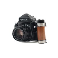 Product: Pentax SH 67 II body w/- wooden grip + original strap + 105mm f/2.4 grade 9