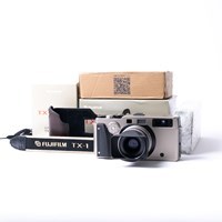 Product: Fujifilm SH TX-1 Body + leather strap + case + wood grip + 45mm f/4 + ND-2x centre filter + hood (Shutter count: 20 x 10) grade 10