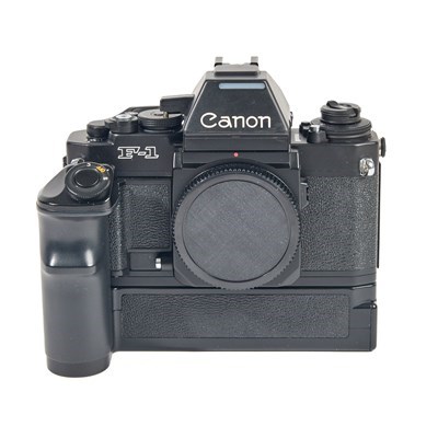 Canon F1 w/- AE prism + Eye Level Finder + AE Power Winder +188A Flash Grade 9